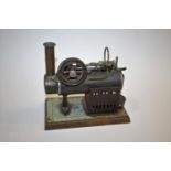 GEBRUDER BING - MODEL STEAM ENGINE a stationary model steam engine with small burner, mounted on a