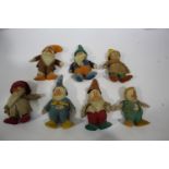 CHAD VALLEY - SEVEN DWARFS a collection of 7 Chad Valley Dwarfs, each figure with a hat. Each figure