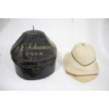 PITH HELMET & TIN CASE a vintage pith helmet by Gieves, London, size 6 7/8, in its original tin case