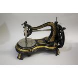 19THC CAST IRON SEWING MACHINE - JONES a 19thc cast iron base sewing machine, hand crank and with