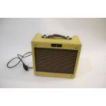FENDER TWEED SERIES GUITAR AMP - BRONCO a 1994 Solid State 15 watt amp with a tweed covered case,