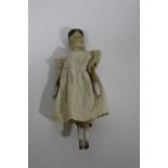 19THC WOODEN DOLL a small peg jointed wooden doll with painted face and hair, 16.5cms high.