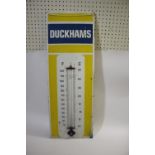 DUCKHAMS ENAMEL SIGN a large enamel sign with attached thermometer (thermometer damaged), with