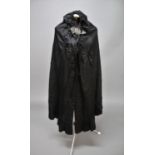 VINTAGE CLOTHING including a late 19thc/early 20thc black silk cloak with white metal buckle