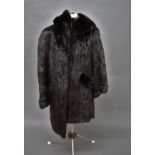 1960'S CANADIAN SQUIRREL FUR COAT a 3/4 length fur coat with pockets on each side and silk lined,