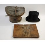 LEATHER CASED TOP HAT a leather hat box with patterned interior, with a black Top Hat The Tween