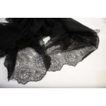 19THC BLACK LACE SHAWL a 19thc shawl with a floral design, 180cms by 180cms.