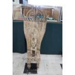 TIMOR TRIBAL FIGURE with a figure seated on a large chair or throne, with carved decoration to the