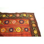 INDIAN EMBROIDERY a large panel of early 20thc Indian rust coloured cotton, embroidered with