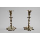 A PAIR OF LATE 20TH CENTURY CAST CANDLESTICKS on hexafoil bases with shell decoration, knopped,