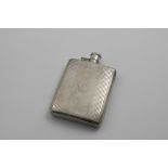 A MID 20TH CENTURY RECTANGULAR SPIRIT FLASK with engine-turned decoration, curved to fit the pocket,