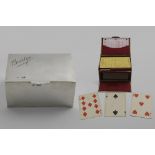 A LATE VICRTORIAN PLAYING CARDS BOX inscribed "Bridge" on the cover, with a fall-front and a lined