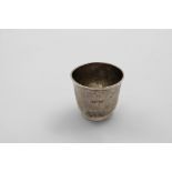 CHANNEL ISLES:- A late 18th century beaker of plain campana form on a collet foot, scratched