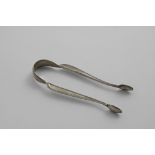 A PAIR OF GEORGE III THREAD PATTERN SUGAR TONGS with the arms at 90 degrees to the bow, engraved