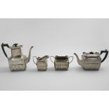 A LATE VICTORIAN FOUR-PIECE TEA & COFFEE SERVICE with part-fluted rectangular bodies, button feet