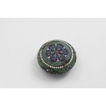 A LATE 19TH CENTURY RUSSIAN CLOISONNE ENAMELLED SNUFF BOX of compressed circular form with a flush-