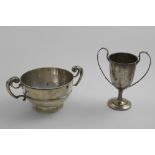 AN EDWARDIAN CUP OF SHALLOW CIRCULAR FORM with two harp-shaped handles, by J. Wakely & F.C. Wheeler,