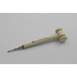 A VICTORIAN NOVELTY MOUNTED IVORY PENCIL in the form of a gavel or hammer with a slide action, by S.