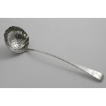 A GEORGE III IRISH PROVINCIAL SOUP LADLE with a wrythen-fluted bowl and a feather-edge stem,