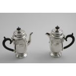 A PAIR OF EARLY 20TH CENTURY CAFE AU LAIT POT of baluster form with engraved upper bodies, stepped