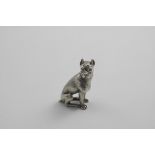 A LATE 20TH CENTURY CAST FIGURE OF A BOXER DOG sitting on its haunches with ears erect, maker's mark