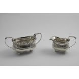 A GEORGE IV TWO-HANDLED SUGAR BOWL & MATCHING CREAM JUG with tongue and dart borders and ball