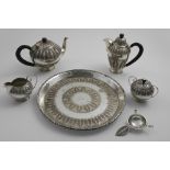 A MIDDLE EASTERN TEA & COFFEE SERVICE TO INCLUDE:- A tea pot, coffee pot, sugar bowl & cover, milk