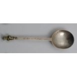 A CHARLES II WEST COUNTRY APOSTLE SPOON The gilt figure of St. Thomas with builder's square and