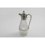 A VICTORIAN MOIUNTED CUT-GLASS CLARET JUG with a slender baluster body & loop handle, the mount