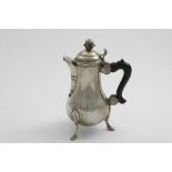 AN 18TH CENTURY MALTESE COFFEE POT on three legs with hoof feet, the plain baluster body with a