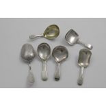 A RUSSIAN CADDY SPOON with a scoop shaped bowl and engraved decoration, Moscow 1890 and five various