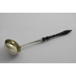A MID 19TH CENTURY RUSSIAN LADLE with a turned hardwood handle, an oval bowl with gilt interior,