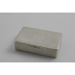 A VICTORIAN LARGE RECTANGULAR SNUFF BOX with rounded corners, engine-turned decoration and a