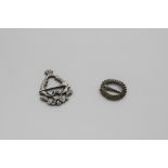 A SMALL MEDIEVAL SILVERGILT ANGULAR BROOCH with a ribbed border and a "Luckenbooth" badge or