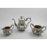 GAME BIRDS:- A William IV embossed three-piece tea set with lobed, baluster bodies chased with