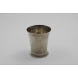 A LATE 18TH CENTURY BEAKER with a plain, flaring body and a moulded foot, struck underneath with a