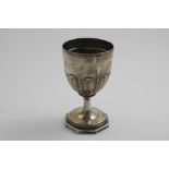 A GEORGE III WINE GOBLET on an octagonal pedestal foot with a braided border, the bowl with a