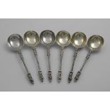 A SET OF SIX VICTORIAN SPOONS with cast figure terminals, part-twist stems and deep oval bowls, by