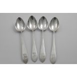 A SET OF FOUR GEORGE III IRISH PROVINCIAL TABLE SPOONS with pointed ends, crested, by Joseph