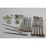 A SET OF FIVE GEORGE III TABLE KNIVES AND SIX TABLE FORKS (with steel blades & tines), with leaf-