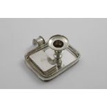 A VICTORIAN RECTANGULAR CHAMBERSTICK with rounded corners, bead borders and a lift-out vesta case,