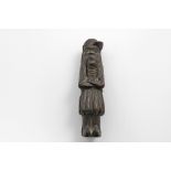 A LATE 19TH CENTURY BLACK FOREST CARVED WOODEN NUTCRACKER carved in the form of a grumpy figure with