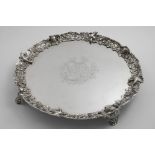A GEORGE III SALVER of shaped circular outline with a cast, openwork border of fruiting vines and