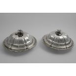 A PAIR OF WILLIAM IV VEGETABLE DISHES of shaped circular outline with gadrooned borders and