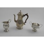 A MID 20TH CENTURY THREE-PIECE COFFEE SET with leaf-capped scroll handles and gadrooned borders,