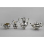 A VICTORIAN ENGRAVED FOUR-PIECE TEA & COFFEE SERVICE with circular bodies, bead borders and vacant