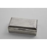 AN EARLY 20TH CENTURY RECTANGULAR CIGARETTE BOX with a bevelled cover, monogrammed, the cover