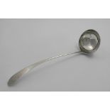 A GEORGE III SCOTTISH SOUP LADLE with a Celtic point and a circular bowl, engraved crest and
