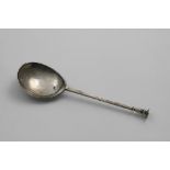 A CHARLES I SEAL TOP SPOON with a slender gilt terminal, pricked with the initials "IH" between