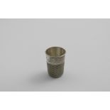 AN EDWARDIAN NOVELTY TOT CUP in the form of a thimble, inscribed "Just a Thimbleful", maker's